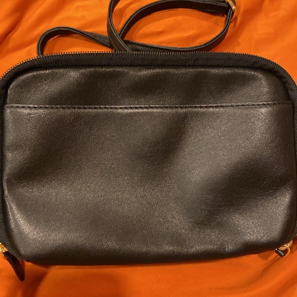 Tumi crossbody bag.
Length is 8.5 inches 
Height is 5.5 inches - Picture 3 of 15